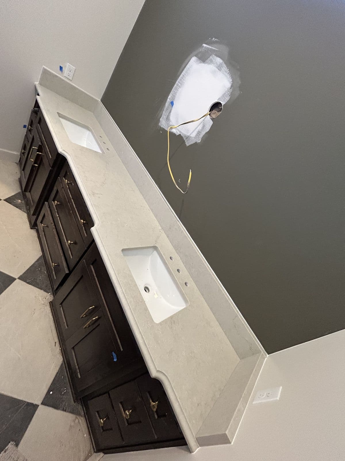 Dark vanity with stone countertop